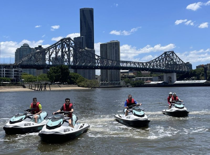 four jet skis story bridge